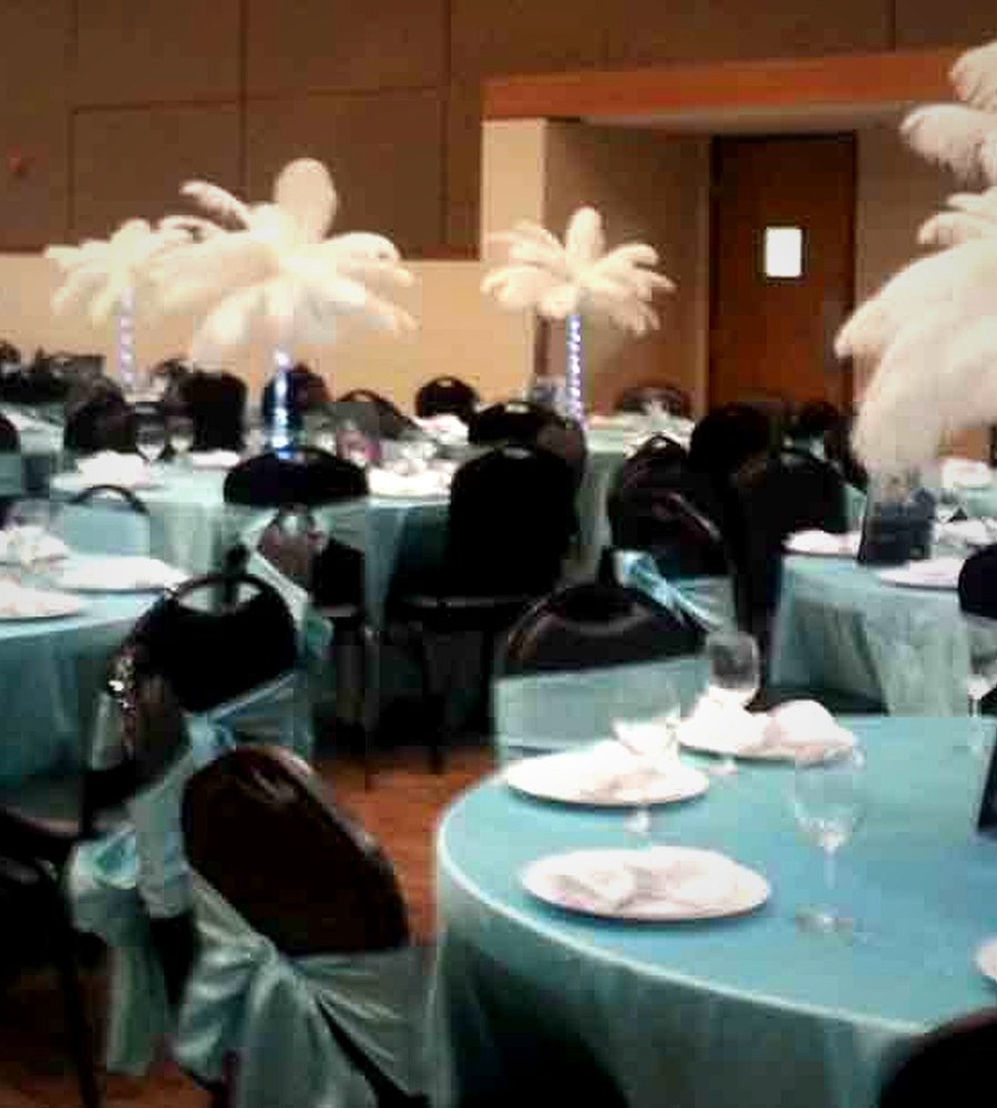 Event room with feather centrepieces
